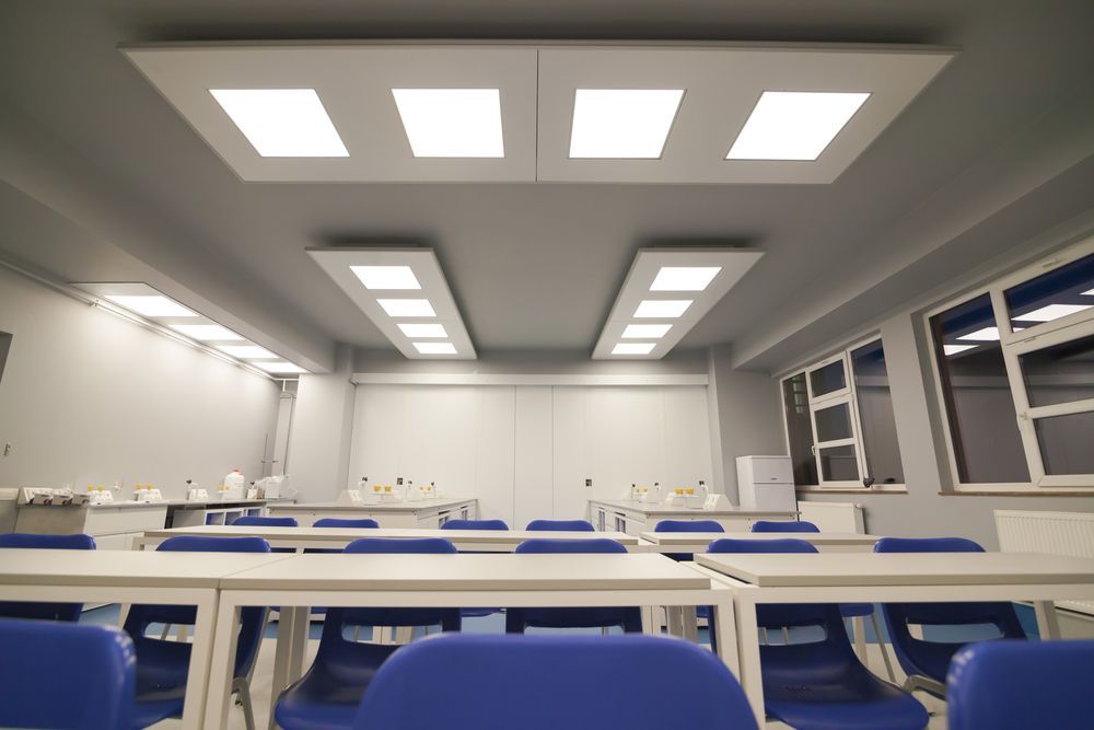 Empty Modern Classroom With Bright Ceiling Lights — Sparky Mid North Coast In Forster, NSW