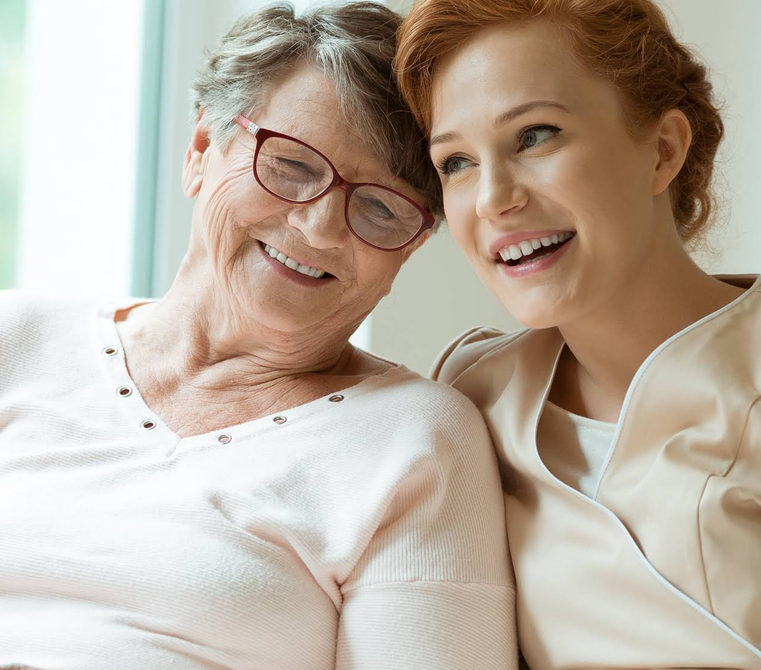 Thema Home Care  Professional caregiver looking confident and approachable in a warm home setting