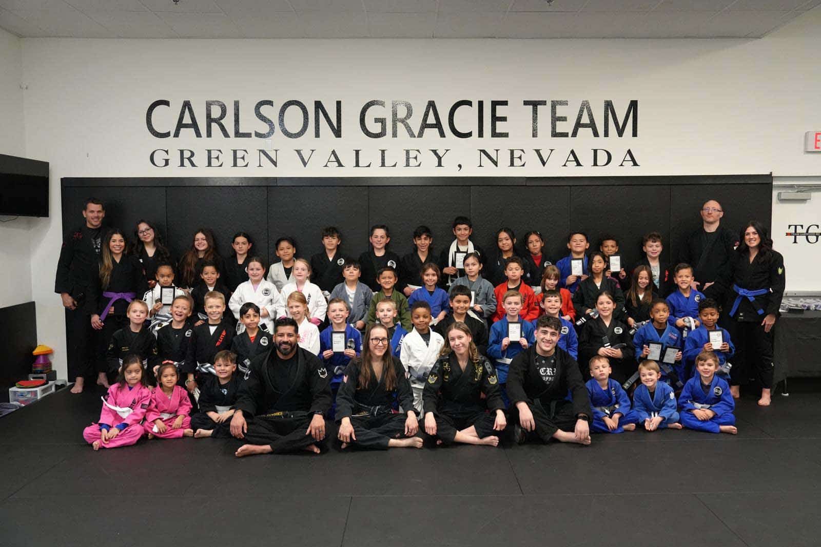 Carlson Gracie Team group photo in Green Valley, Nevada, with martial arts uniforms and colorful gi outfits