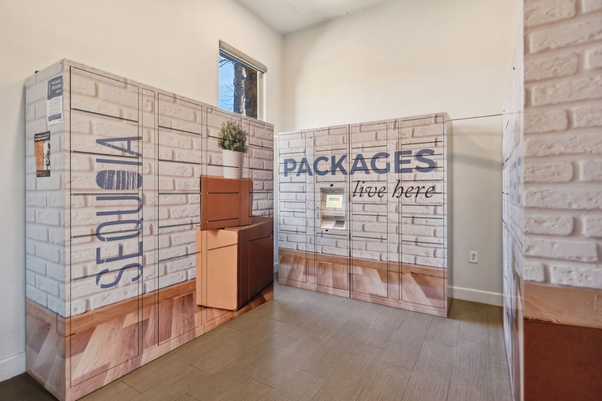 Indoor package locker area with brick-pattern lockers and a small window.