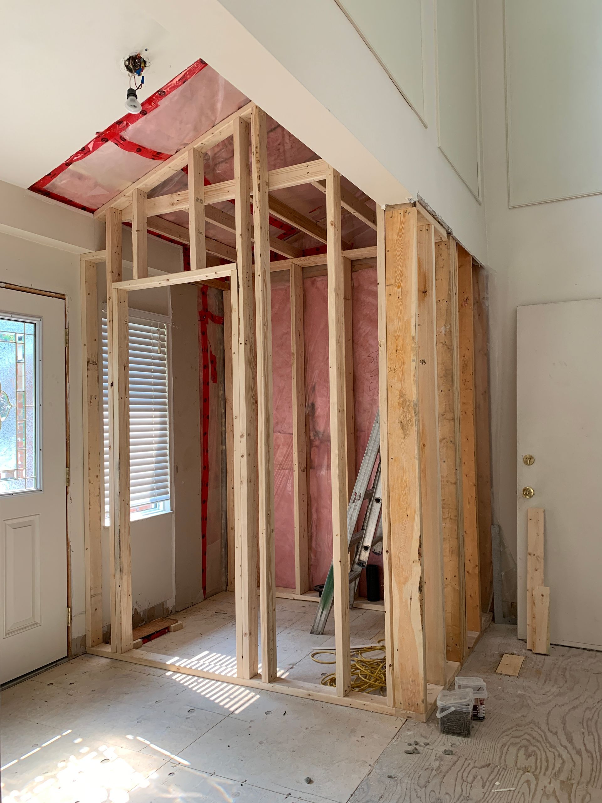 A room is being built with wooden beams and insulation.
