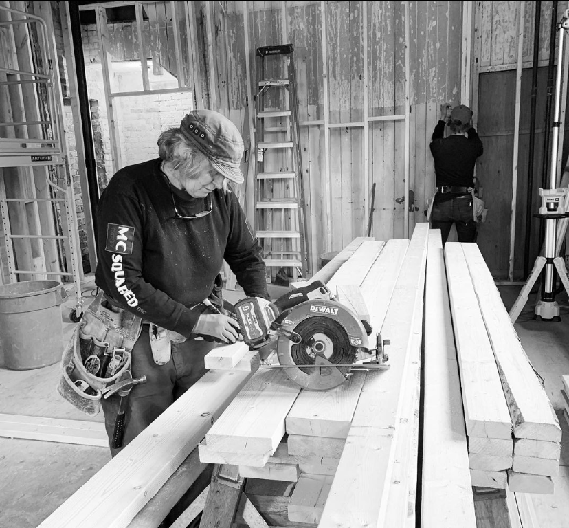 woman working wearing a McCarty Squared tee.