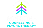 The logo for mcguire recovery has a tree with leaves on it.