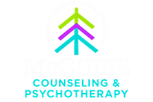 The logo for mcguire recovery has a tree with leaves on it.