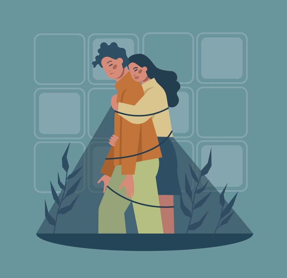 A man and a woman are tied together with a rope.