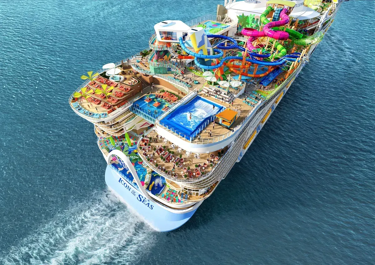 A large cruise ship is floating on top of a body of water.