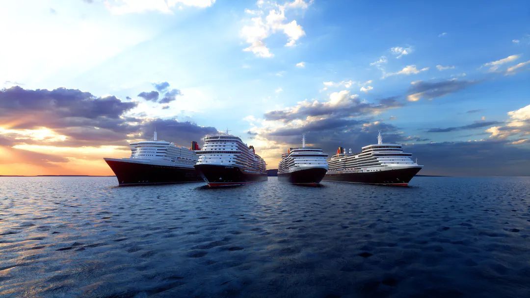A group of cruise ships are floating on top of a large body of water.