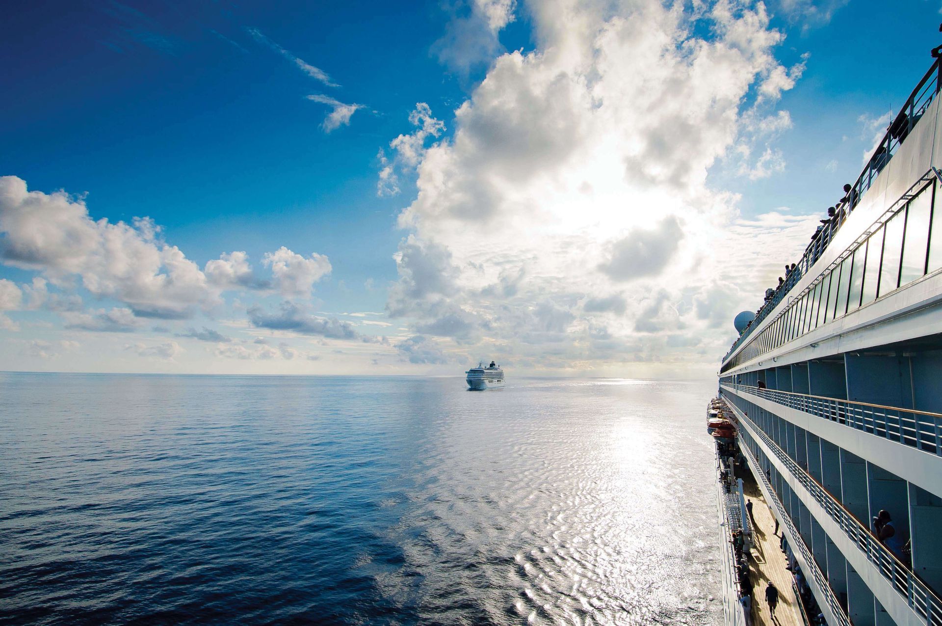 A cruise ship is floating on top of a large body of water.