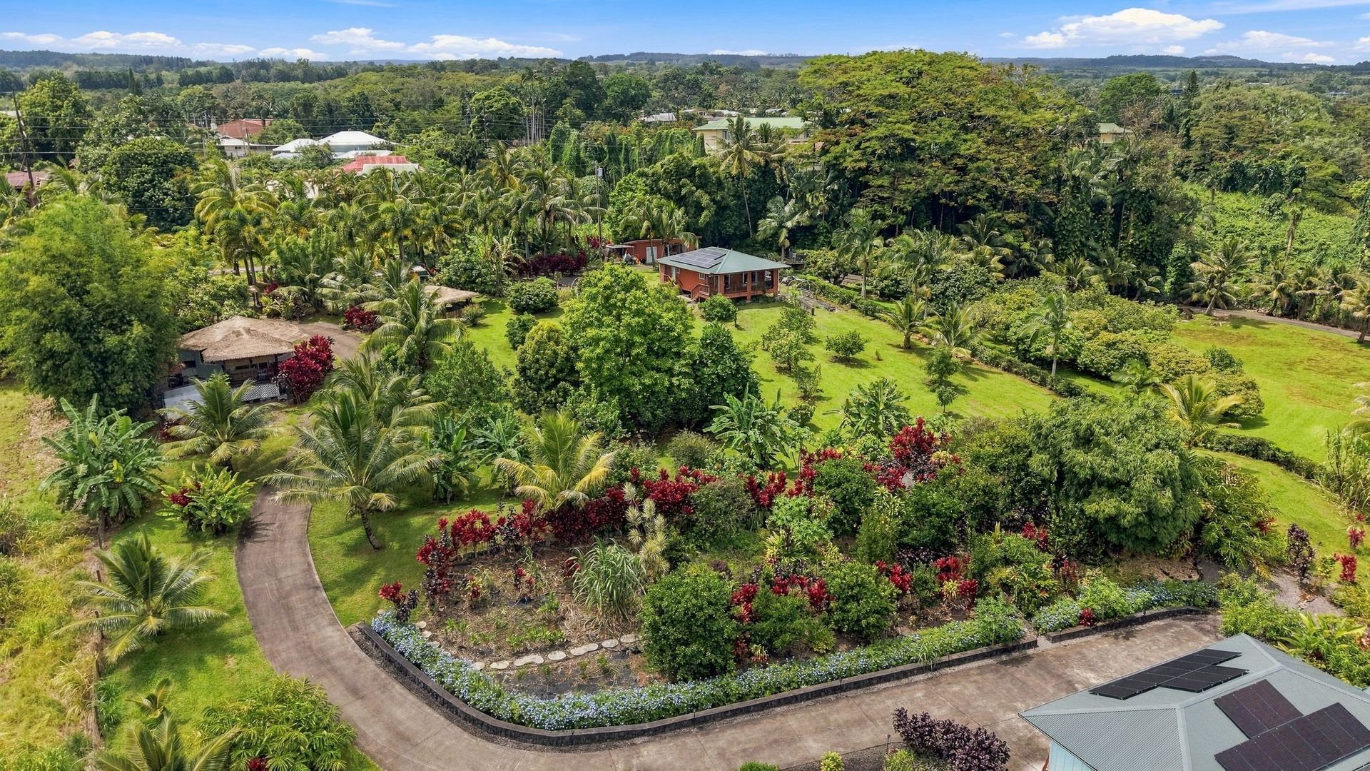 Aerial view of Koili Point’s garden paths, palms and tropical grounds in Papaikou.