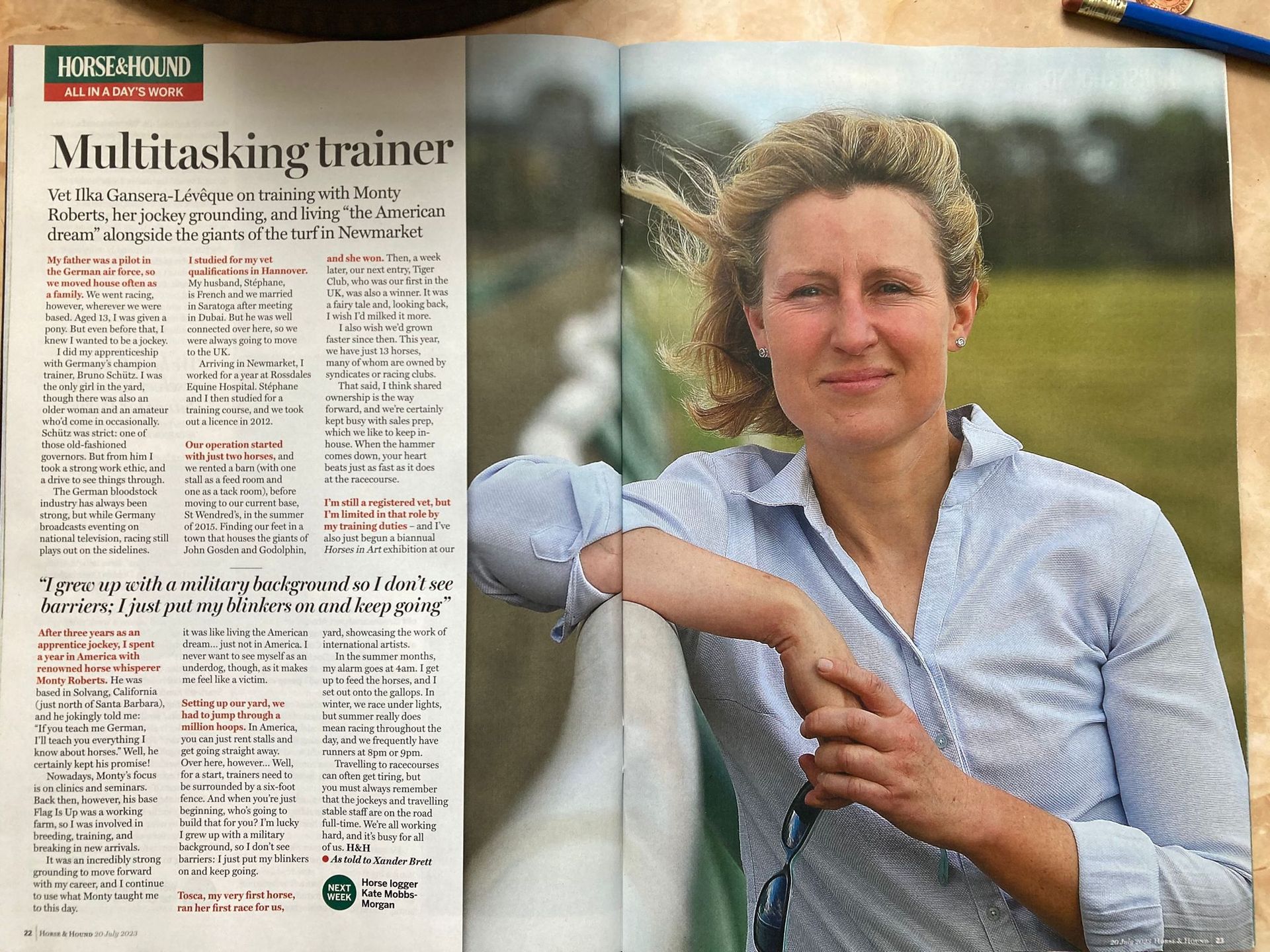 A magazine is open to a page that says multitasking trainer