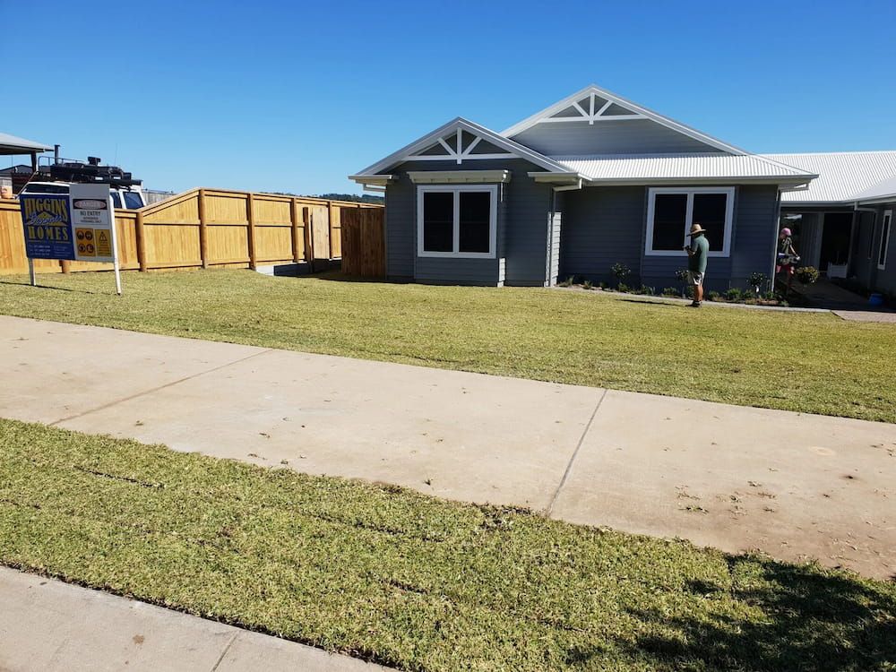 A House With A For Sale Sign In Front Of It — Marian Lawns In Sarina, QLD
