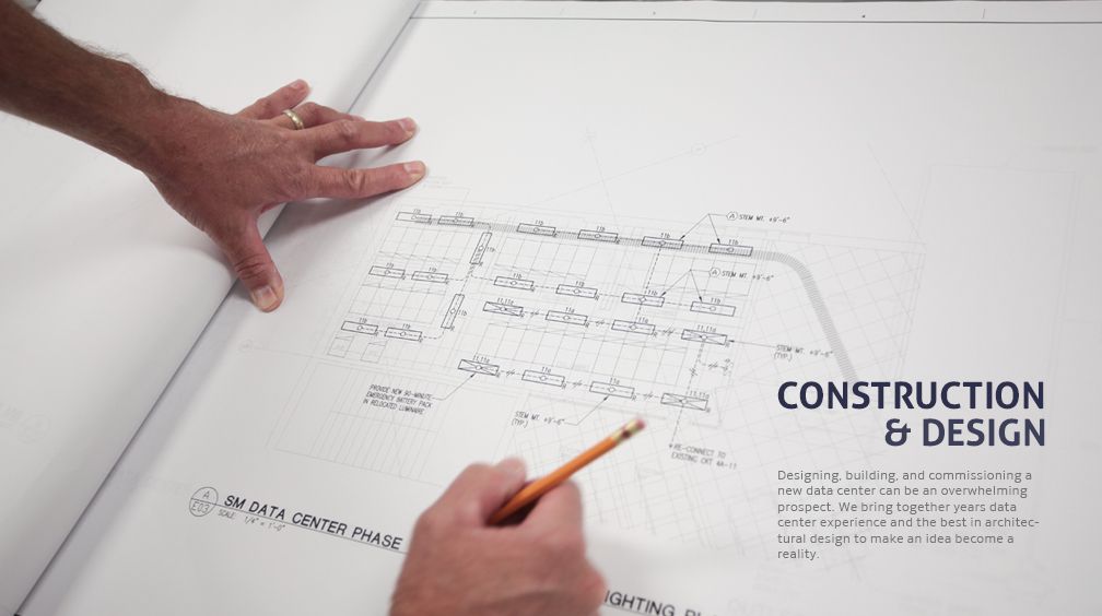 A person is writing on a piece of paper with a pencil.