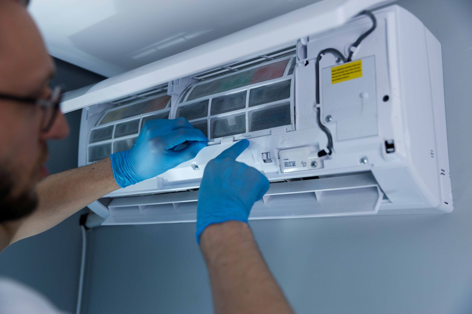Professional Technician Installing a New Air Conditioning Unit