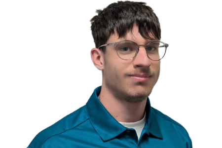 A person with dark hair and glasses wears a teal collared shirt against a white background.