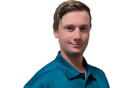 Portrait of a man in a teal collared shirt against a white background
