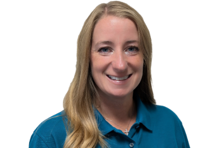 A person with long blonde hair and a smiling expression, wearing a teal polo shirt against a plain white background.