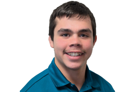 A person wearing a teal polo shirt, smiling at the camera against a white background.