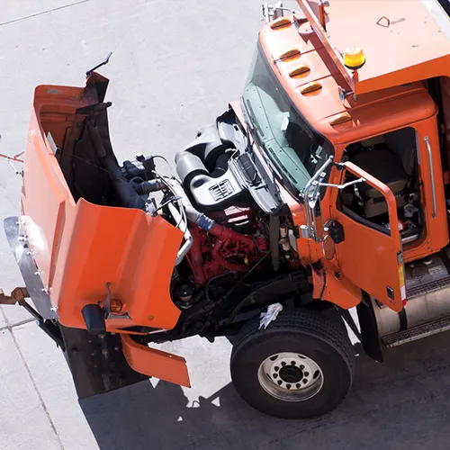 an orange truck with the hood up and the door open