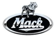 A mack truck logo with a dog on top of it.