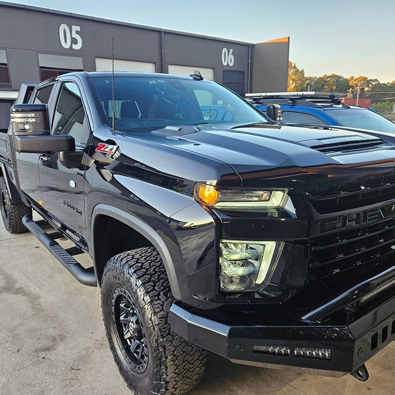 A Black truck is Parked in Front of a Building with the Number 05 on it — On Point Detailing Wagga in East Wagga Wagga, NSW