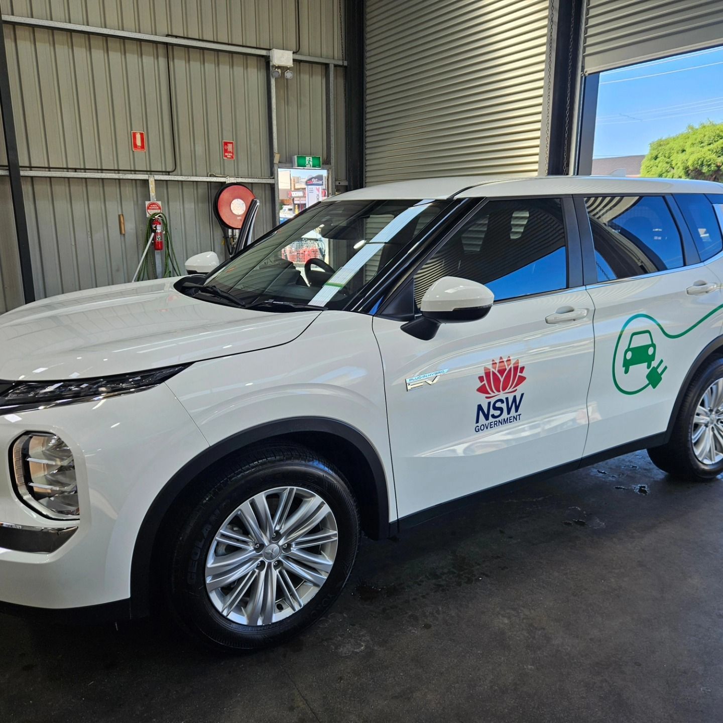 White NSW-branded SUV parked in a garage, shown in side view. — On Point Detailing Wagga in East Wagga Wagga, NSW