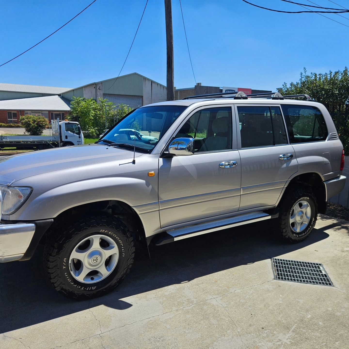 Silver SUV parked on a sunny residential street near houses and utility poles — On Point Detailing Wagga in East Wagga Wagga, NSW