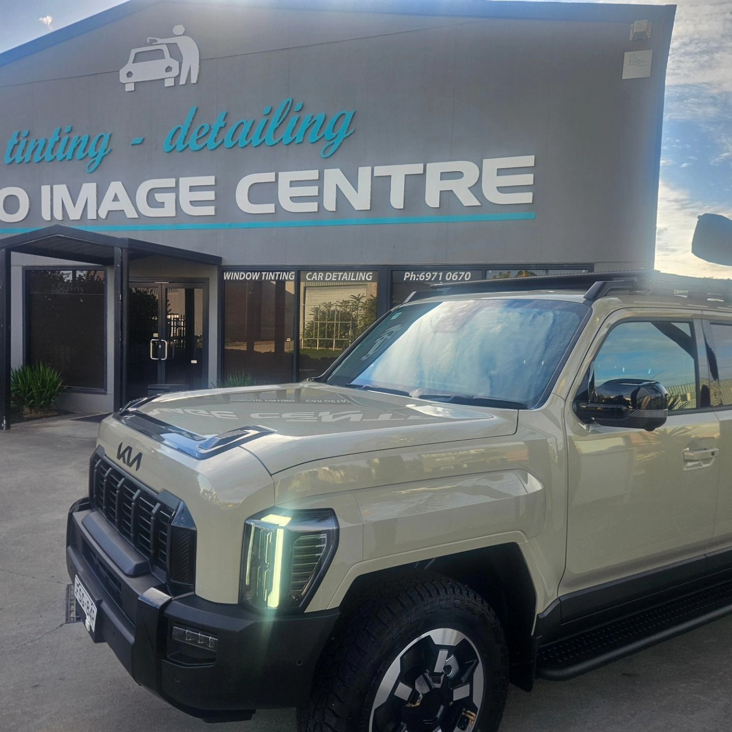White pickup truck with black trim and snorkel parked outdoors under a partly cloudy sky. — On Point Detailing Wagga in East Wagga Wagga, NSW