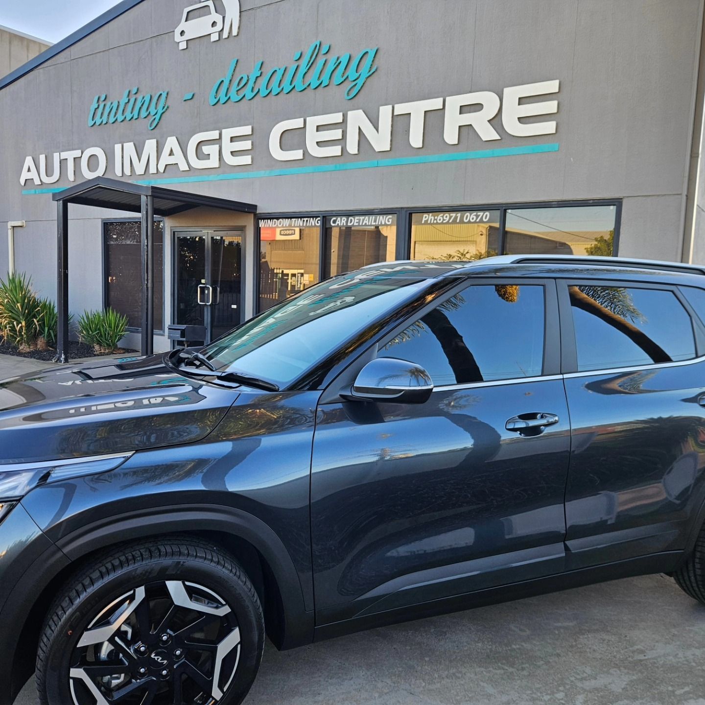 Dark blue SUV parked outside Auto Image Centre detailing shop — On Point Detailing Wagga in East Wagga Wagga, NSW