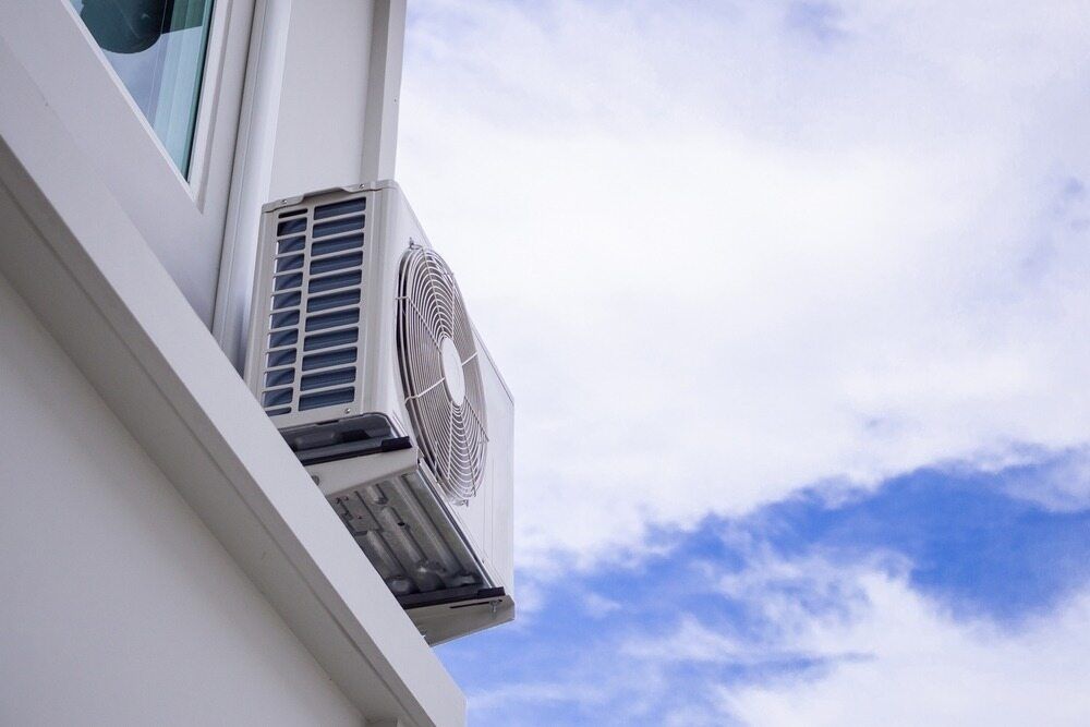 White Air Conditioning Unit on a Building Exterior — Hinterland Air Conditioning Sunshine Coast in Montville, QLD