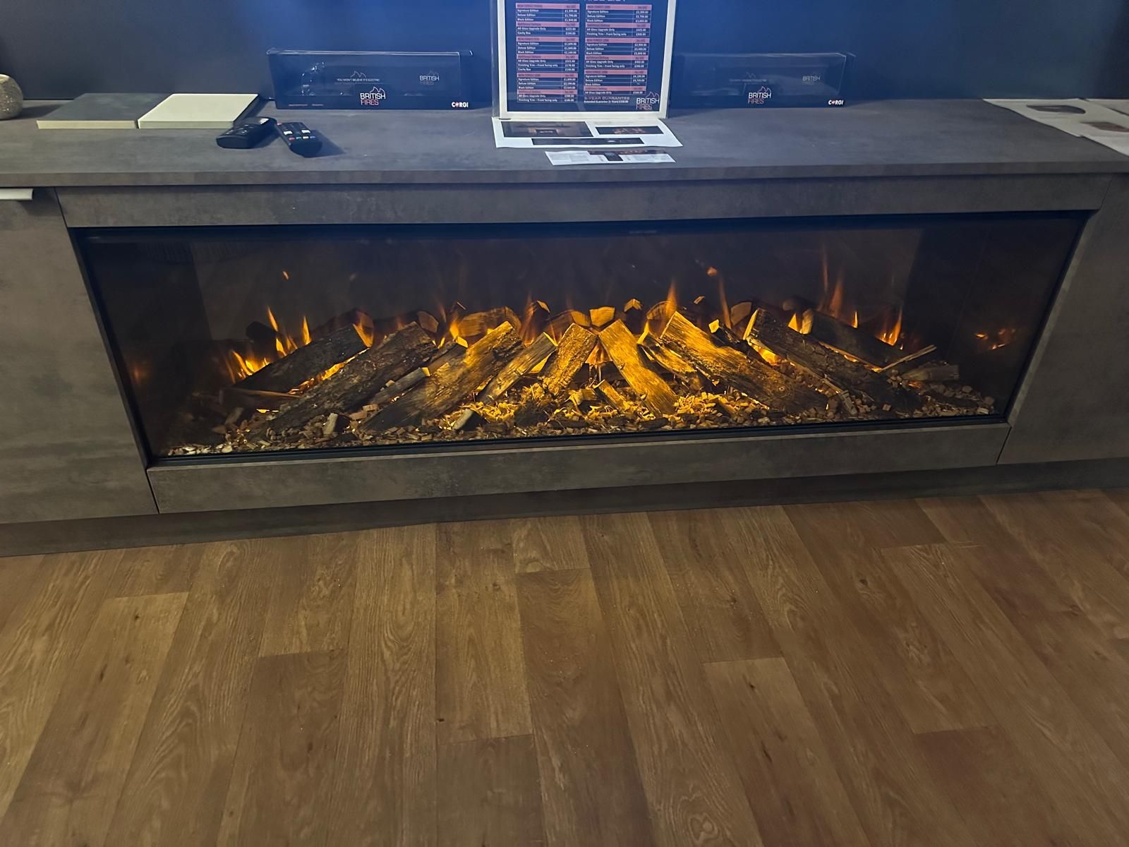 Stylish electric fireplace with glowing wooden logs and sleek design