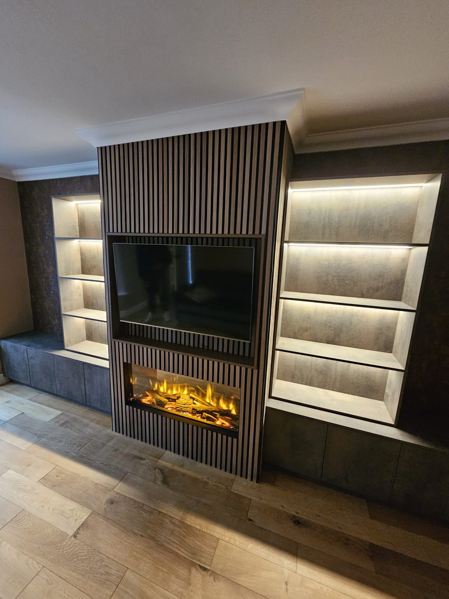 Stylish room with a linear fireplace and modern shelving units