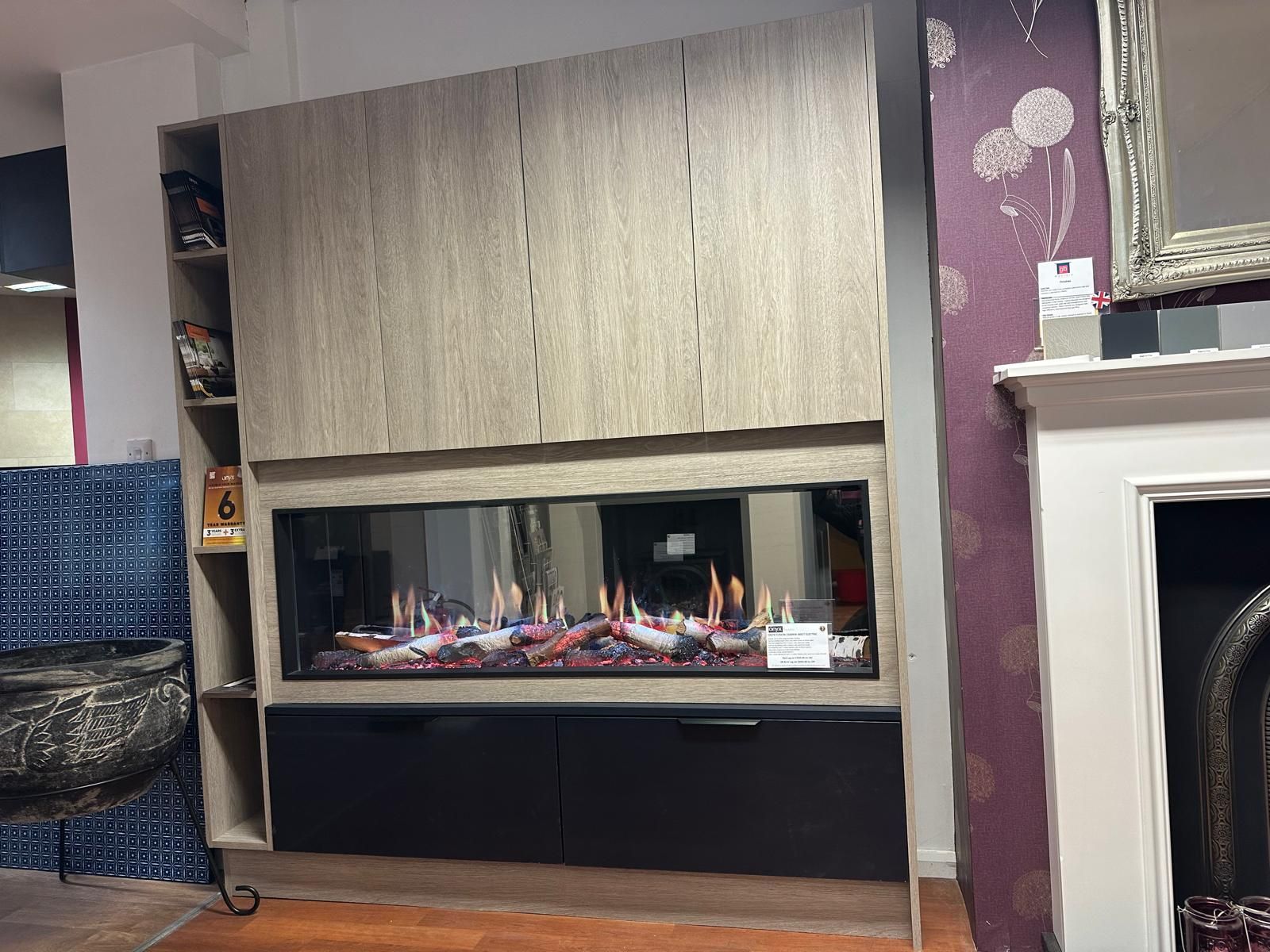 Chic electric fire feature with vibrant flames and elegant wood cabinetry