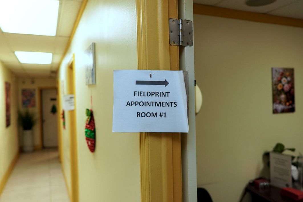 Hallway with sign directing to 