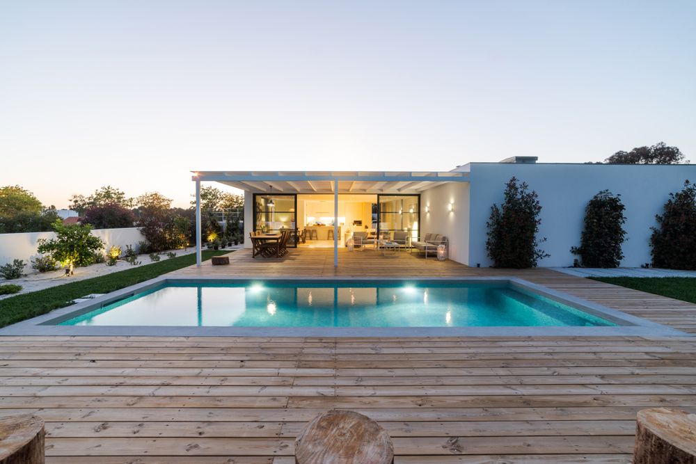 A Large Swimming Pool in the Backyard of a House — Bloomscapes in Lennox Head NSW