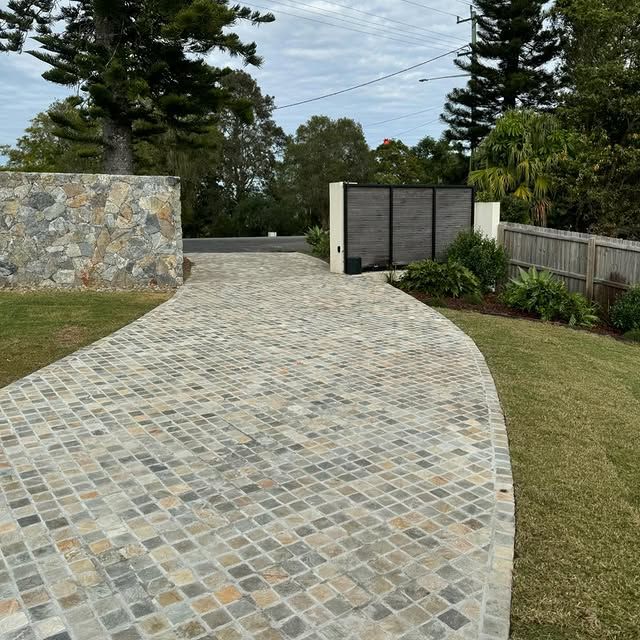 A Brick Walkway facing road front Surrounded by Trees and Bushes — Bloomscapes in Lennox Head NSW