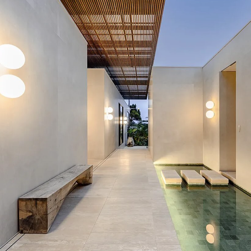 A large high-end home with tiles and a water feature — Bloomscapes in Lennox Head NSW