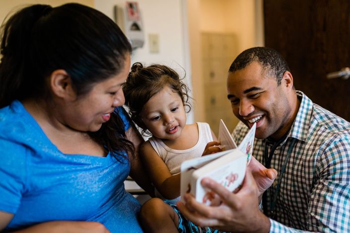 A Broomfield family reading together through a Reach Out and Read Colorado program