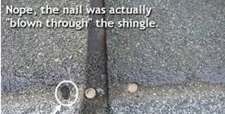 A close up of a shingle with a hole in it.