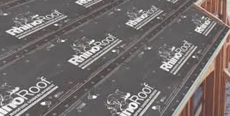 A row of rhino roof sheets sitting on top of a wooden roof.