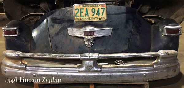 A black car with a license plate that says 2ea 947