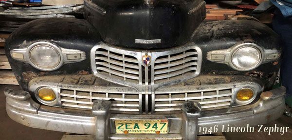 A black car with a license plate that says 2ea 947