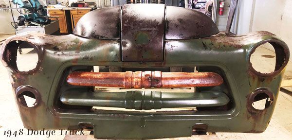 The front of a 1948 dodge truck is being restored