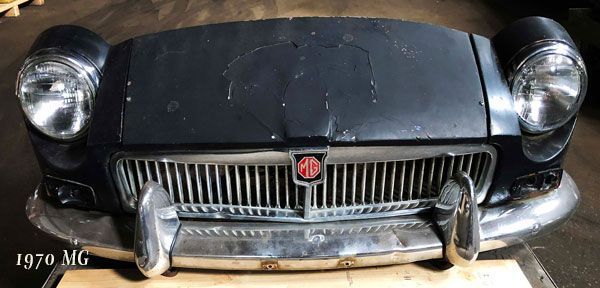 A 1970 mg car is sitting on a wooden table