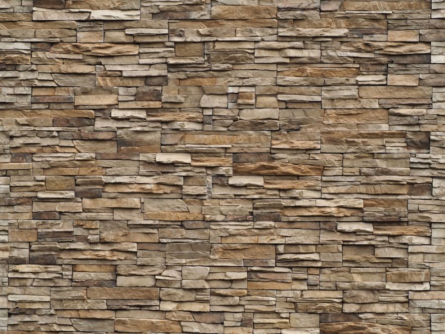 A Close Up of a Stone Wall With a Brick Pattern — Cairns Roofing Contractors Pty Ltd in Bungalow, QLD