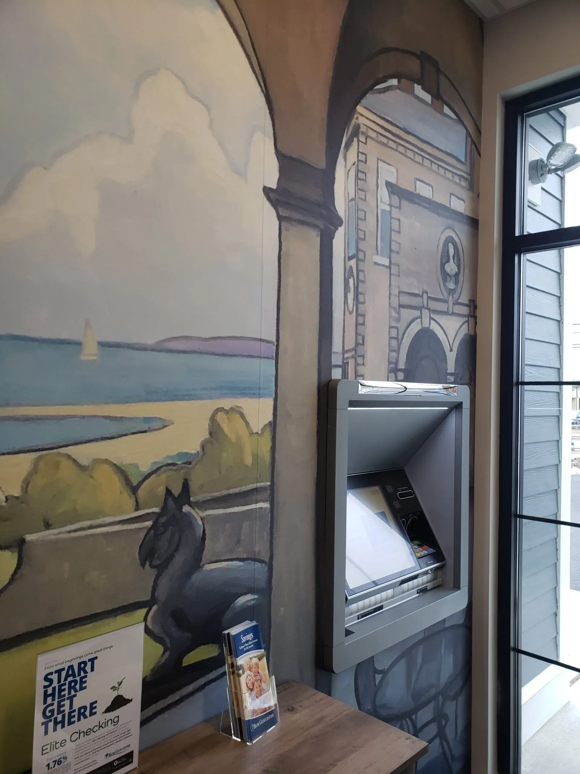 A room with a painting of a horse on the wall