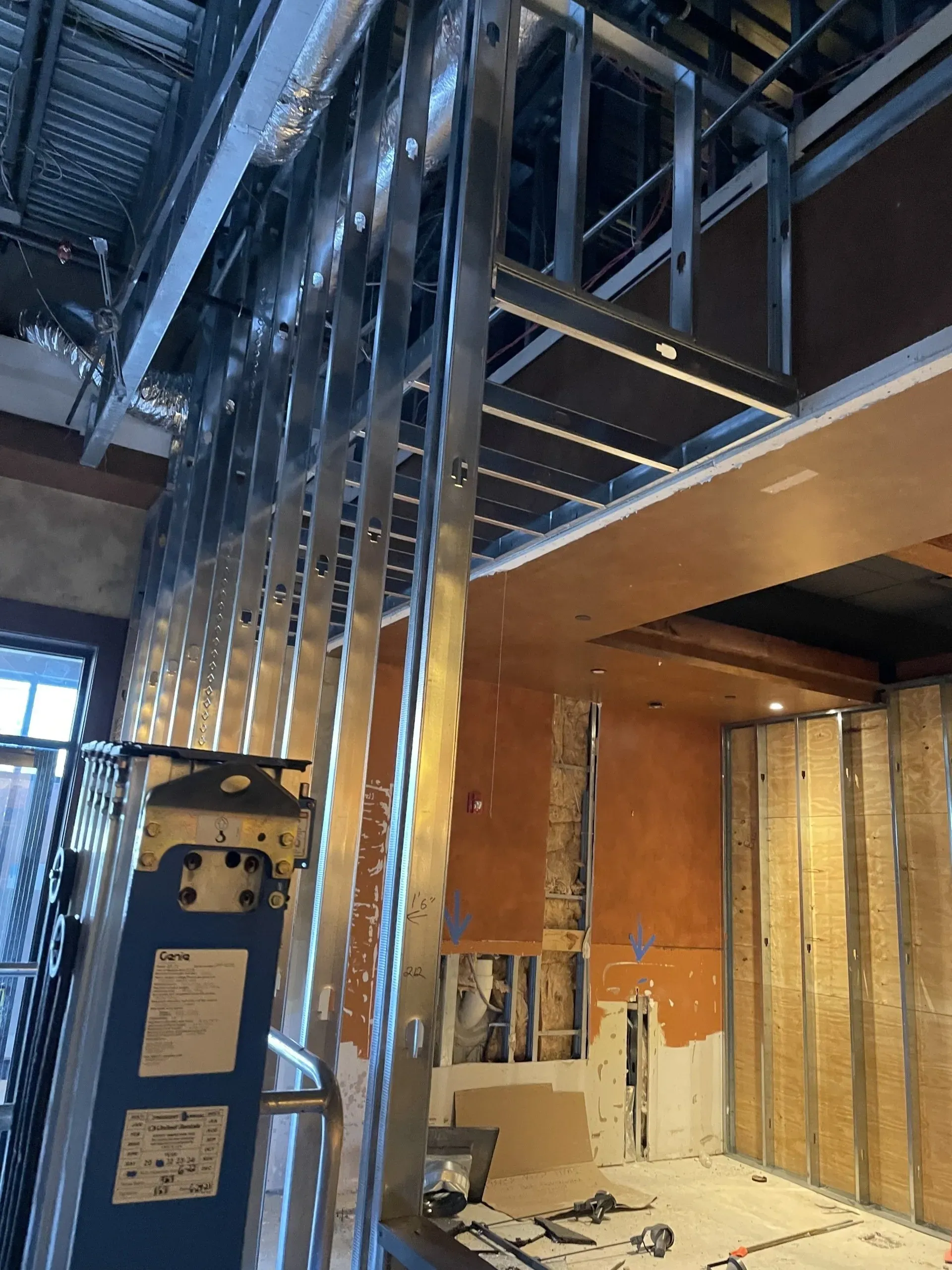 A room under construction with a ladder in the corner