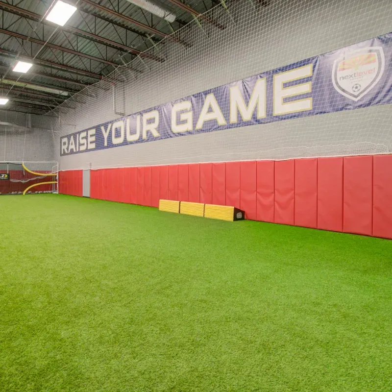 There is a banner on the wall that says raise your game.