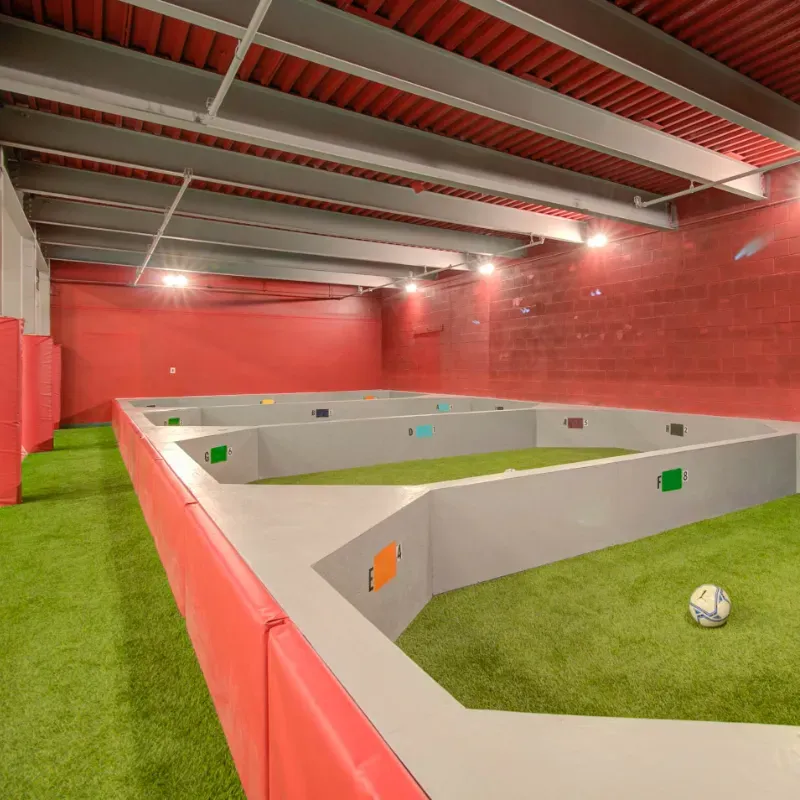 A soccer ball is in the middle of a soccer field