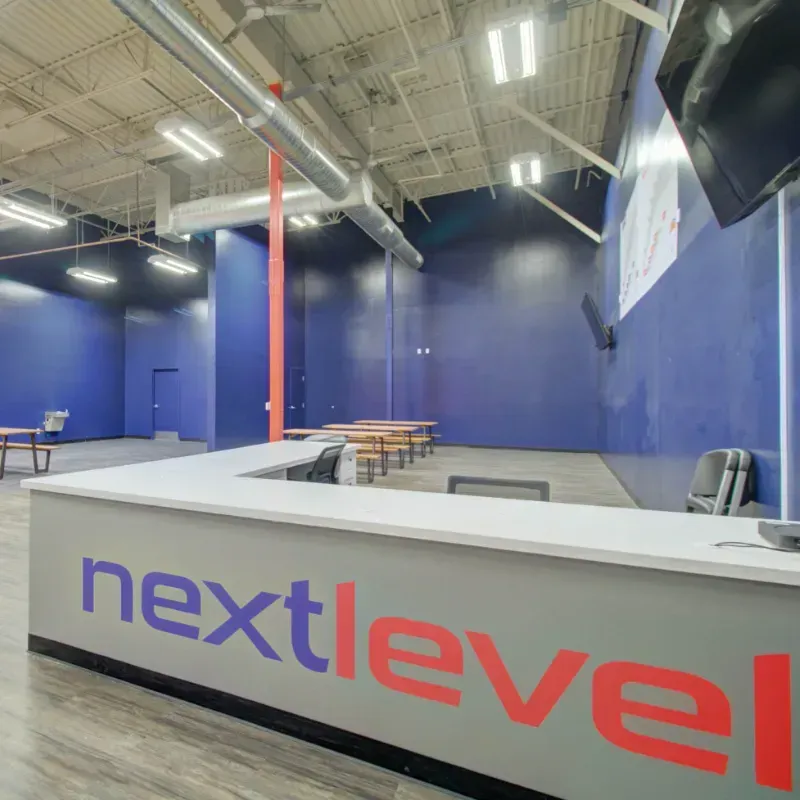 A large room with a counter that says nextlevel on it