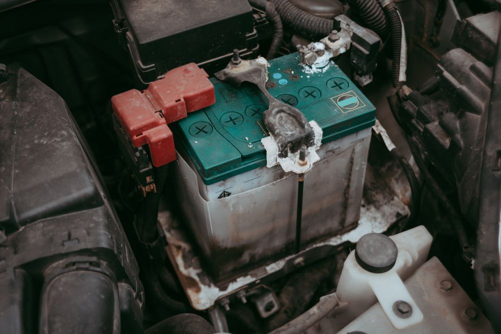 A Car Battery with A Green Top and Heavy White Corrosion — Morisset Automotive in Morisset, NSW